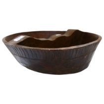 An African carved wooden bowl with sectional divider, diameter 40cm