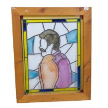 A lead and coloured perspex panel depicting a figure, pine-framed, 67cm x 83cm overall