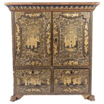 A Chinese black lacquered table-top cabinet, with 2 panel doors revealing a cubby hole fitted