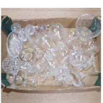 A box of crystal glassware, including vases and red wine goblets