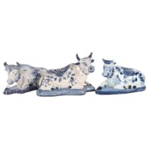 Delft blue and white pottery recumbent cow, length 14.5cm, and 2 similar cows Possibly 1 horn