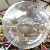 An Italian contemporary pendant light fitting within a large globular glass dome. Overall diameter