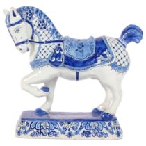 Delft blue and white pottery saddled horse, length 22cm, height 20cm Good condition