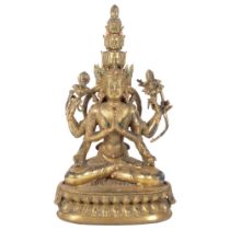 A gilded bronze Hindu God seated in lotus position, H28cm, set with stones