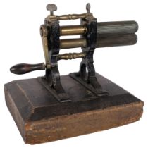 A Vintage machine fluting iron, mounted on wooden stand, H29cm