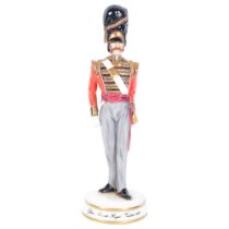 A ceramic figure of a guardsman, limited edition, model no. 7 of 250, by Michael Sutty, depicting an