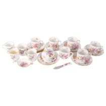 A set of Derby Posies coffee cups and saucers, matching tea strainer and butter knife