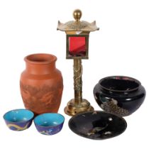 An Oriental red ware vase with dragon decoration, 24cm, 4 cloisonne bowls and dishes, and a cast-