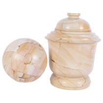 A reconstituted marble jar and cover, H29cm, and a similar ball on plastic stand