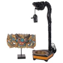 A carved wood dragon table lamp with dish under, H49cm, and a carved and painted gilded wooden