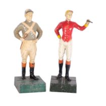 2 cold painted cast-metal figures, study of jockeys, on plinth bases, overall height 26cm