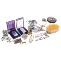 A silver backed dressing table brush and mirror, various vintage lighters,
