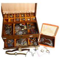 A brown jewellery box full of costume jewellery, including some silver items, and various watches