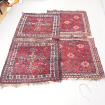 Two similar red-ground Shiraz rugs. Largest 180x100cm Each formed of two smaller panels joined