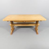 A mid-century Danish oak trestle dining table with pegged construction and drawer under in the