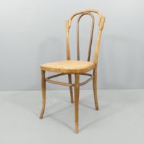 J & J Kohn - A model NR80 bentwood easy chair, with cane seat and maker's impressed mark beneath.