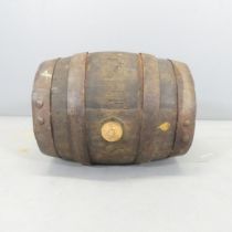 A small coopered oak barrel, labelled Charrington, London. 36x43cm