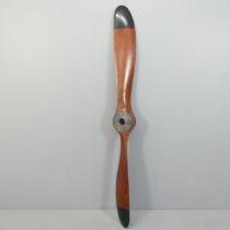 A large stained wood propeller, Length 197cm.