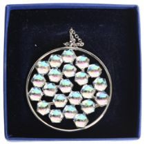 SWAROVSKI - a palladium plated circular disc pendant and chain, boxed