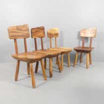 A set of four Brutalist solid wood chairs in the mid-century manner.