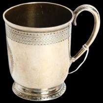 A Victorian silver christening mug, with engraved decoration and blank cartouche, hallmarks for