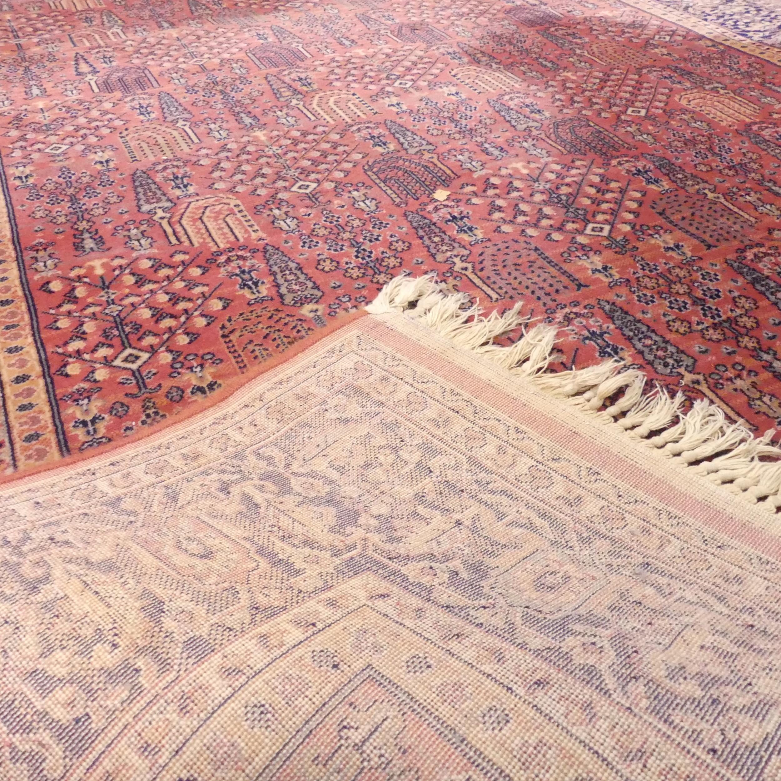 A red-ground Persian machine made rug. 242x160cm. - Image 2 of 2