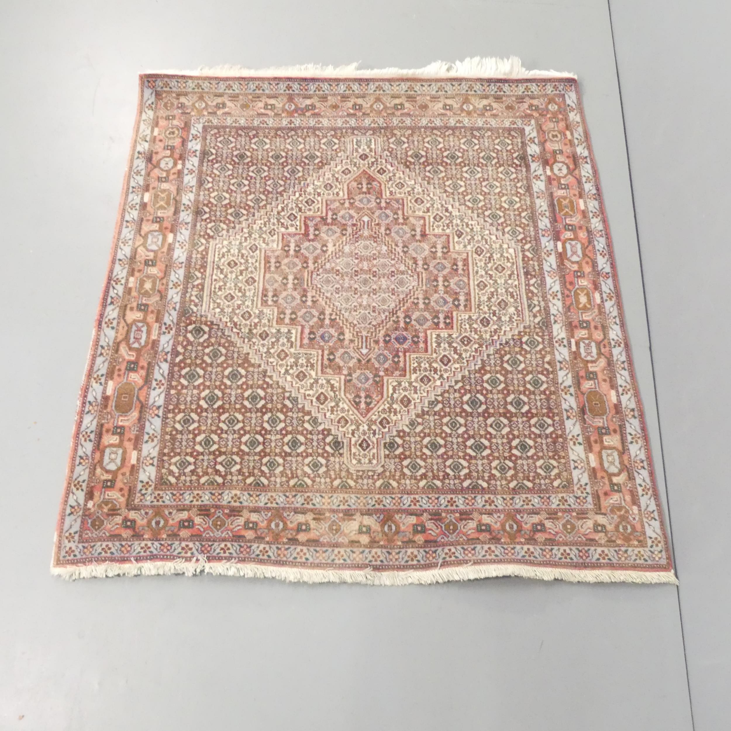 A red-ground Gazak rug. 141x129cm.