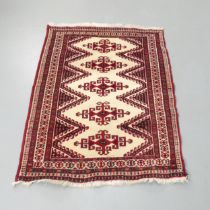 A red-ground Tekke rug. 127x102cm