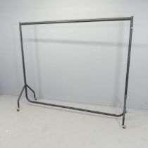 A tubular metal industrial clothes rail. 185x154x52cm. Dismantles into seven sections for easy