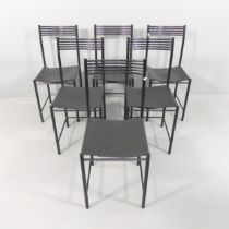 A set of six post-modern Memphis style dining chairs, with leather seats and tubular metal frames.