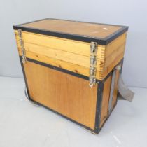 A modern plywood fishing tackle box, with three lifting hinged compartments above the main box.