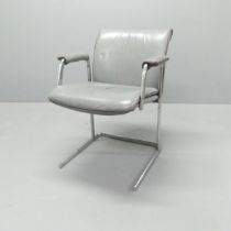 A mid-century office chair, with leather upholstery on a tubular chrome base. Appears identical to