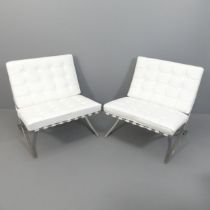 A pair of white leather upholstered Barcelona style chairs. Overall approximately 77x82x75cm, seat