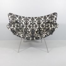 A contemporary design lounge chair on steel rod base. WITH THE OPTION TO PURCHASE THE FOLLOWING