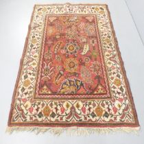 A cream ground Isfahan rug. 205x130cm.