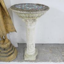 A weathered concrete two-section pedestal, with mosaic top. 42x80cm. A/F. Crack to top section,