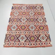 A red and blue ground Kilim rug. 195x134cm.