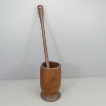 An African hardwood pestle and mortar for crushing maize. Mortar 34x57cm, pestle 150cm.