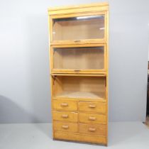 An early/mid 20th century oak haberdashery shop cabinet, made by Dudley & Co. Ltd., Showcase