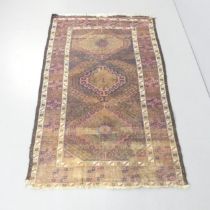 A blue-ground Baluchi rug. 170x103cm. Well worn. Some moth holes. Fringe is damaged.