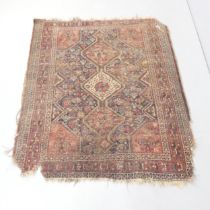 A red-ground Shiraz rug. 140x120cm.