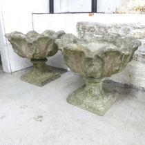 A pair of weathered concrete garden urns. 44x36cm.