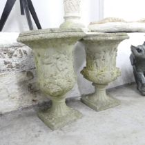 A pair of weathered concrete garden urns. 35x48cm.