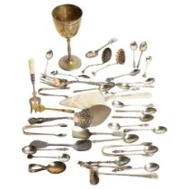 A tray of mixed spoons, cake slice, tea strainer, pickle forks, and an engraved goblet