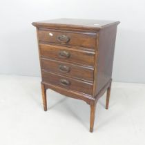 An early 20th century mahogany music cabinet, with drawer fitted interior containing various sheet