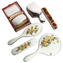 A white and floral enamelled dressing table brush and mirror set, a boxed silver-backed brush, etc