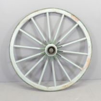 A vintage painted cartwheel with metal tire. Diameter 109cm.