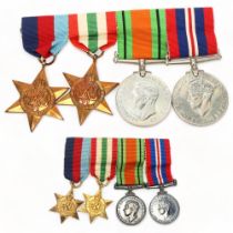 A group of 4 Second War Service medals and miniatures