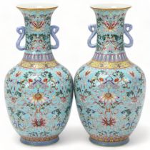 Pair of Chinese pale blue glaze porcelain vases with rui design handles, allover painted enamel