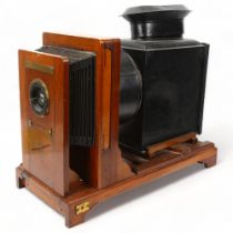 A Victorian mahogany and brass-mounted tinplate magic lantern, base length 49cm